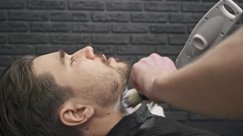Man Receiving Shave at Barbershop