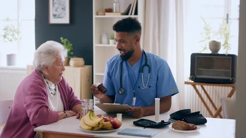 Nurse Visits Senior Woman at Home for Checkup