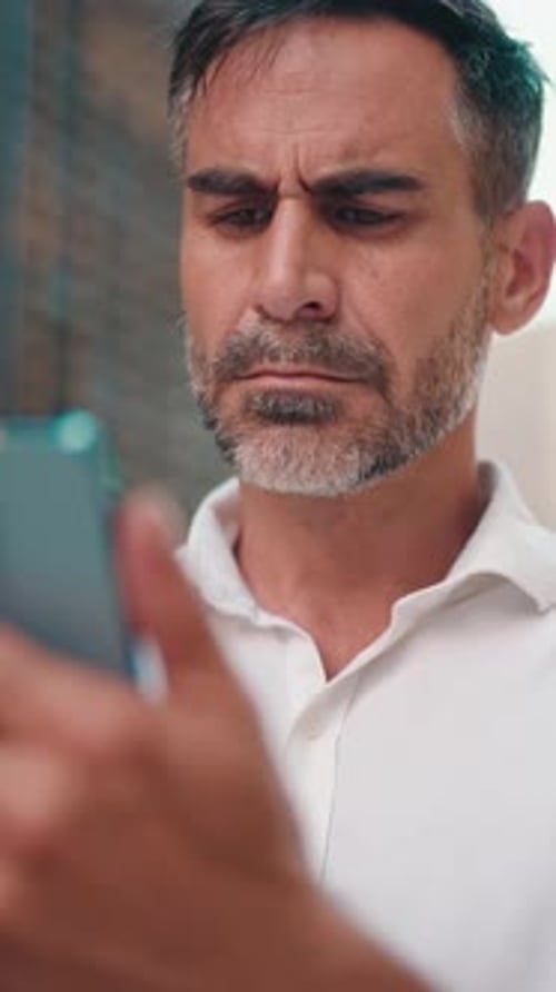 Man with Phone in City Setting