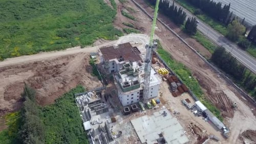 Large residential construction site with cranes, Aerial view