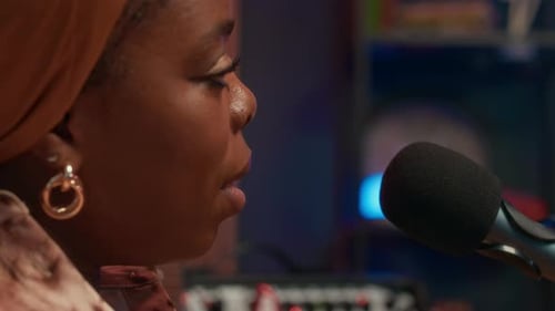 Young Woman Talking in Mic Recording Podcast in Studio