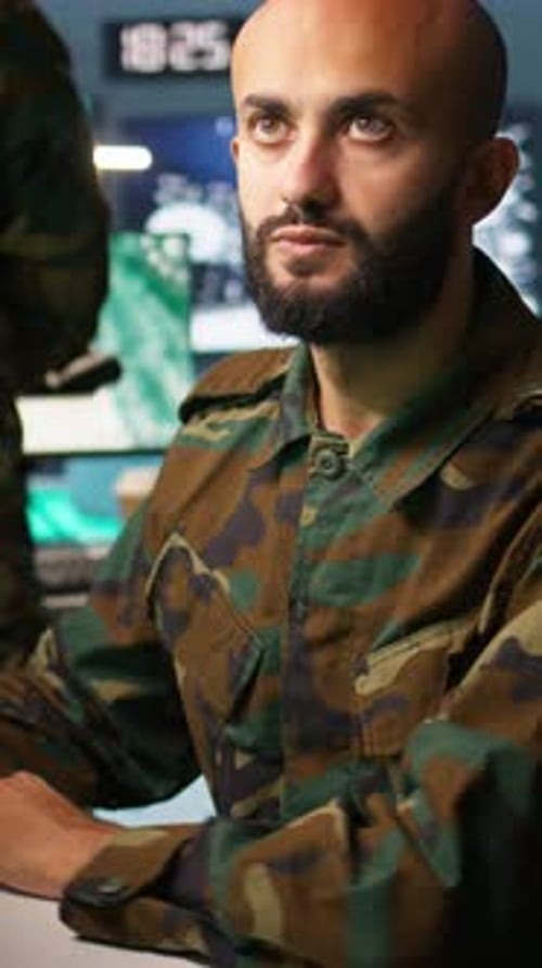 Vertical Video Close Up of Intelligence Corps Expert Controlling Drones Attacking Targets