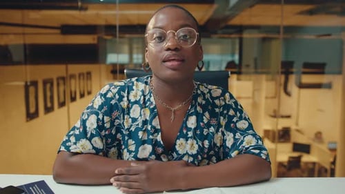 Young Black Businesswoman Talking on Camera at Office Workplace
