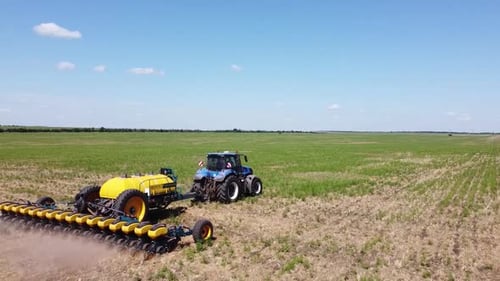 Blue Tractor O.A. Planting Canola On No Till Field