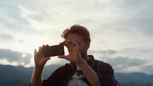 Happy Blogger Take Photo on Smartphone. Closeup Modern Tourist Photographing Mountains Using