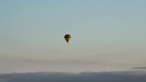 Hot Air Balloon Floating Above the Clouds