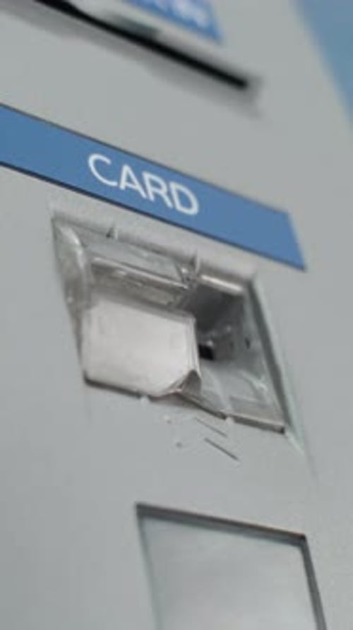 Close Up Shot of Unrecognizable Person Inserting Plastic Card in ATM Machine