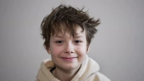Smiling Boy Makes Binoculars with Hands