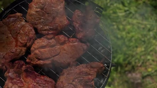 Juicy Steak Cooking on Barbecue Grill