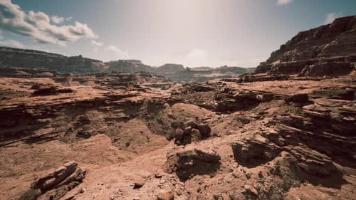 Drone Flyover Through Arid Rocky Canyon Landscape