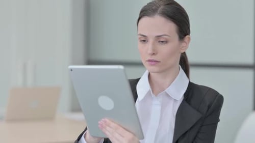 Woman Using Tablet in Office Workplace