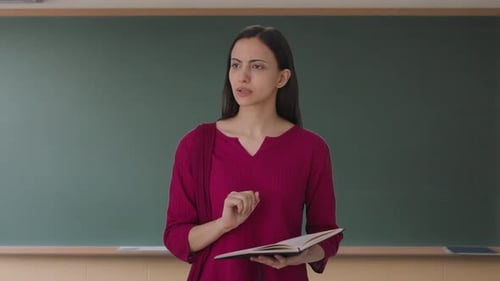 Indian female teacher teaching in class