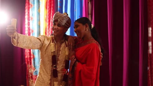 Friends Smiling Taking Selfie at Cultural Wedding Event