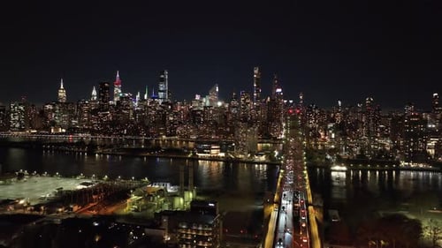 Aerial Views Capture Dazzling Midtown Manhattan Skyline at Night Featuring Traffic Flowing Across
