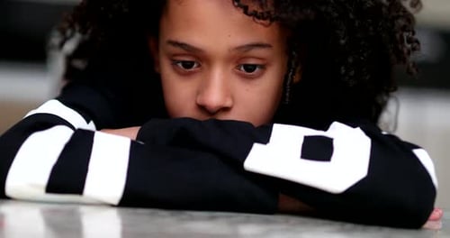 Pensive little girl child, thoughtful sad emotion