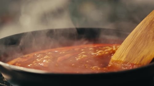 Red Sauce Simmering in a Pan with Spatula
