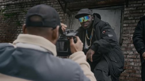 Men Pose for Videographer in Urban Setting