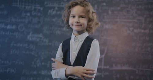 Smiling Child in front of Chalkboard with Math Equations