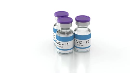 COVID-19 Vaccine Vials on White Surface