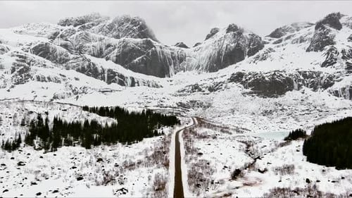 Aerial view of a road through snowy mountains, Norway.