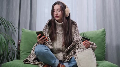 Woman Makes Online Purchase Wrapped in Blanket