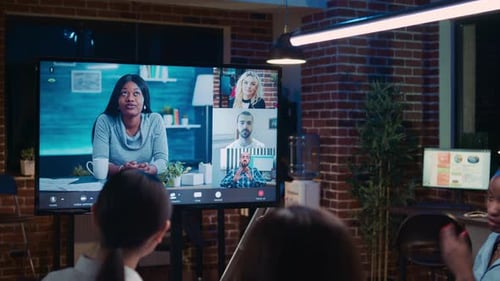 Team on Video Conference in Modern Office