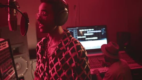 Singer Recording a Song in Music Studio