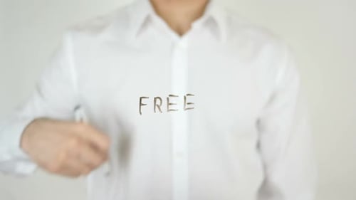 Man Writing on Clear Surface with Marker