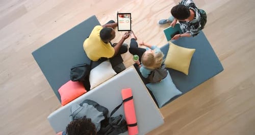 Team, meeting and business collaboration above at the office in project startup ideas on tablet