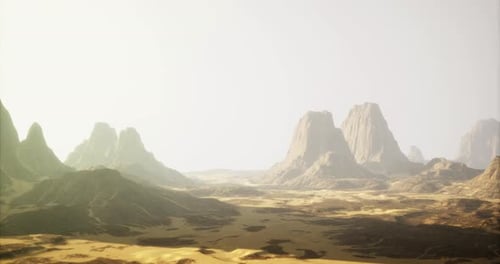 Scenic Desert Landscape with Towering Mountains Under a Hazy Sky