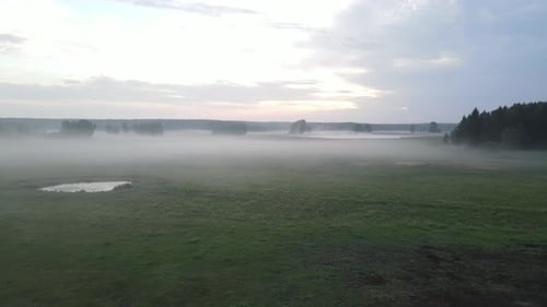 aerial footage from steam field to two white arched hall fly