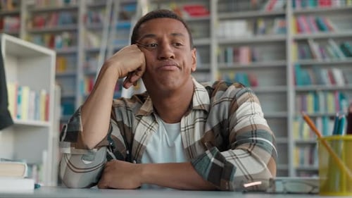 African American Man Student Learner University Library Thoughtful Thinking Pensive Sad Upset Exams