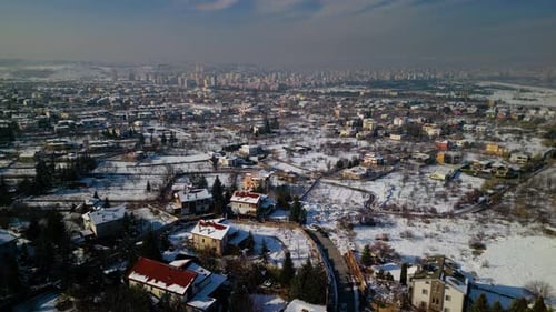 A snowy forest village on a beautiful winter evening