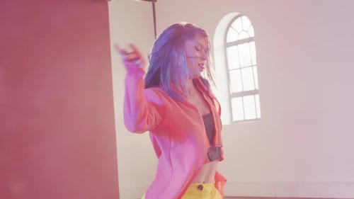 Happy caucasian female dancer dancing alone in dance studio, slow motion