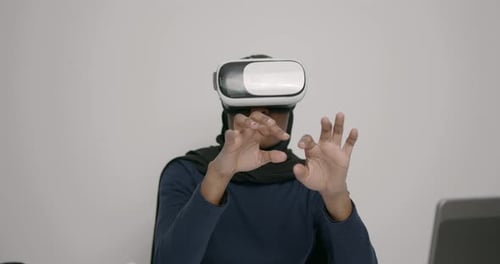 Black Muslim Woman Testing Vr Headset at Office