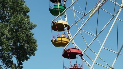 Colorful Ferris Wheel Turning on Clear Day