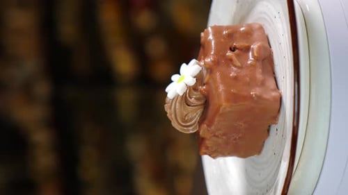 Chocolate Cake Rotating on Stand Dark Background Sweets and Desserts Vertical Footage Bakery and