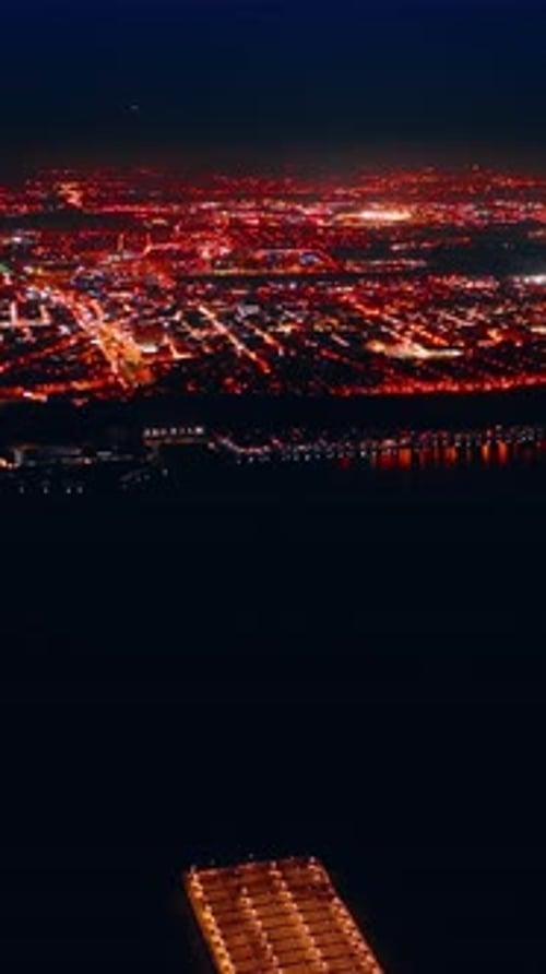 Luminous panorama of New York with billions of lights at night. Footage from above the dark area
