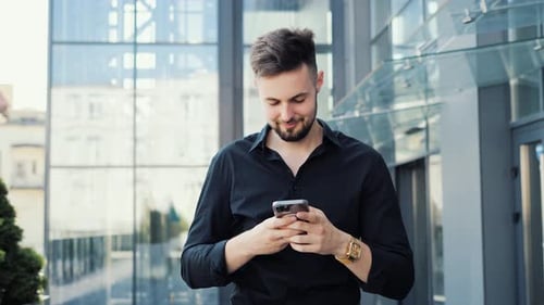 Young Business Man Chatting in Social Media Using Mobile Phone App Smartphone