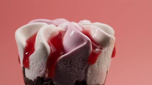 Delicious Ice Cream Cone with Frosting and Syrup