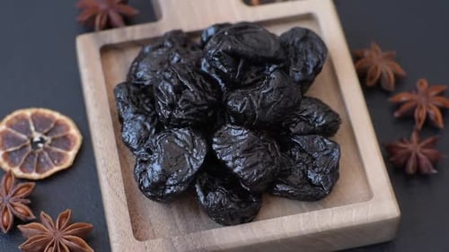 Sweet dried plums or prunes, organic dehydrated fruit for dietary nutrition. Prunes or dried plums