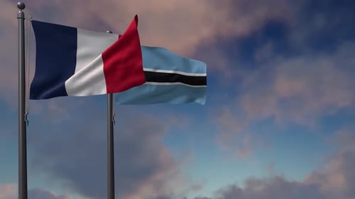 French and Botswana Flags Waving against Cloudy Sky