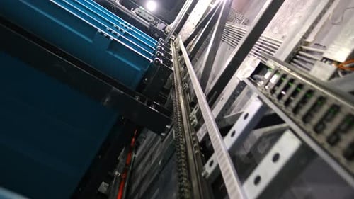 Close-Up of Chain-Driven Mechanism in Automated Robotic Parking System