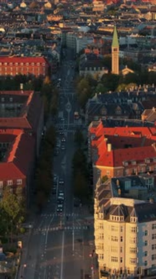 Aerial drone view of Vesterbro district in Copenhagen, Denmark at sunset. Vertical