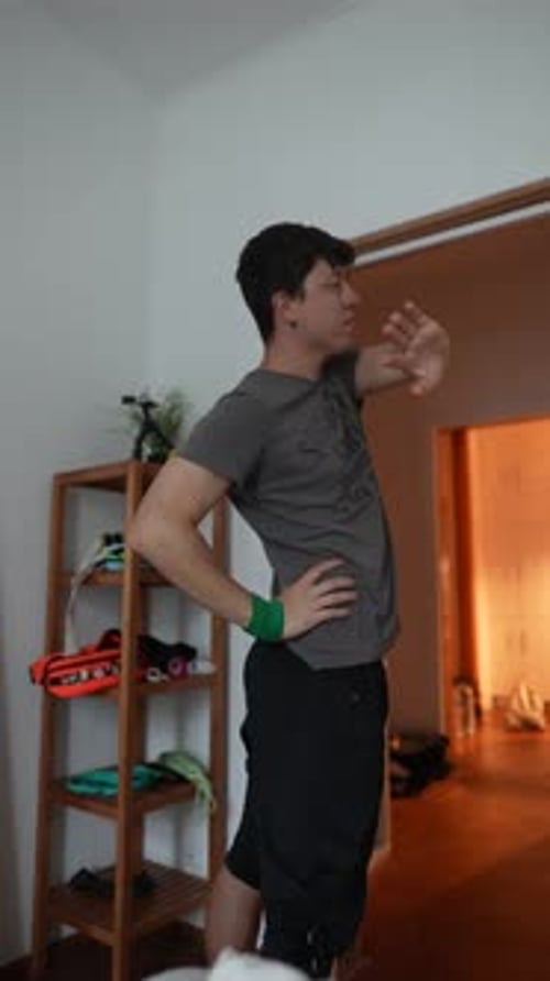 A Young Man Actively Engaging in Various Physical Activities at Home in a Modern Setting