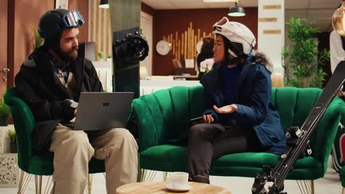 Skiers Using Technology in Upscale Hotel Lobby