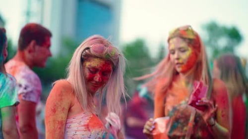 Young Adults Celebrating Holi Festival with Colors