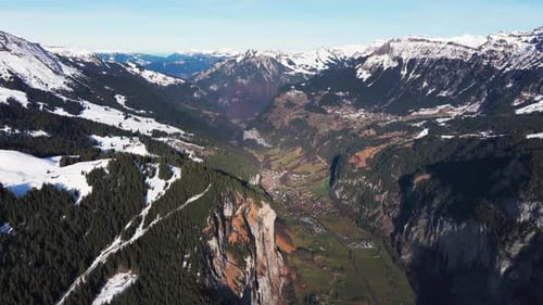 Scenic aerial view of Switzerland mountain valley and town in between
