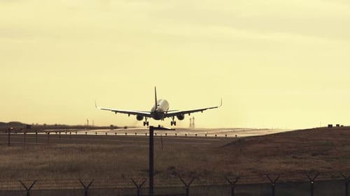 Jet airliner landing on runway.