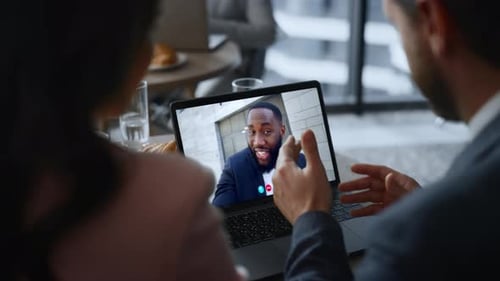 Webcam Company Team Meeting By Laptop Video Connection in Cafe Close Up